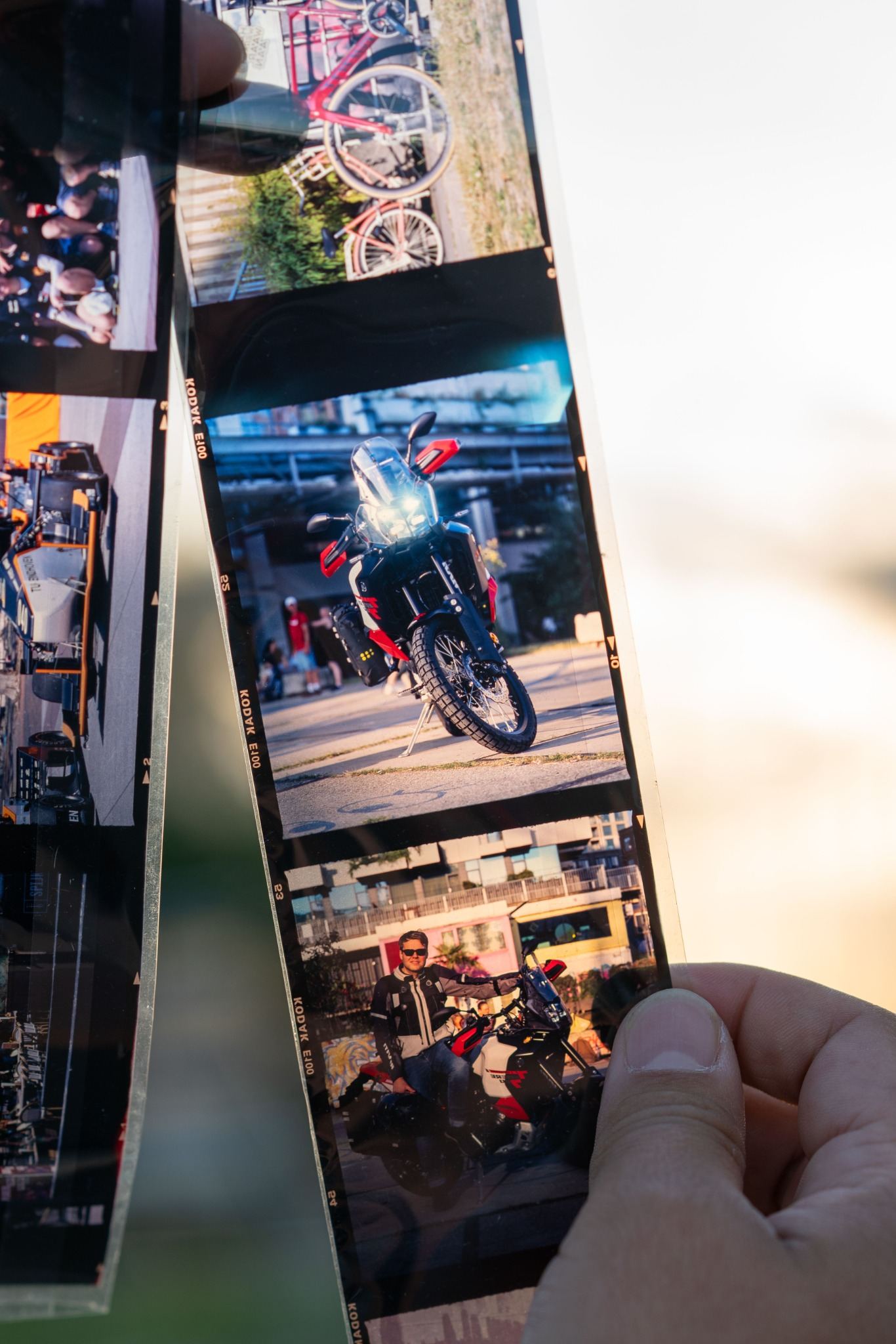 Strip of positive analog film with motorcycle photographs from Miguel Soto’s work.