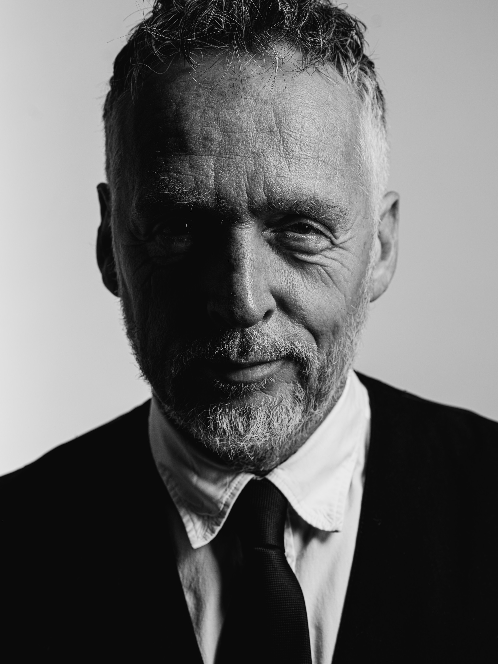 Black-and-white portrait with hard light and high contrast, photographed by Cas van Laar.